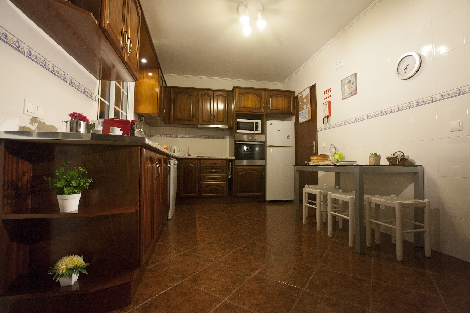 Evening exterior view of Casa da Horta Açores with warm interior lights